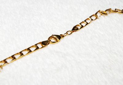 Fio de ouro com cruz de Homem